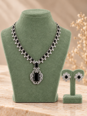 Black American Diamond necklace set with an ornate pendant and matching floral stud earrings