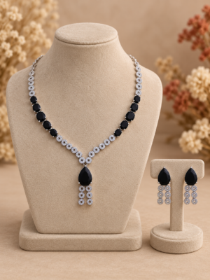 Riddhima black American diamond necklace set with black teardrop stones, floral detailing and matching drop earrings