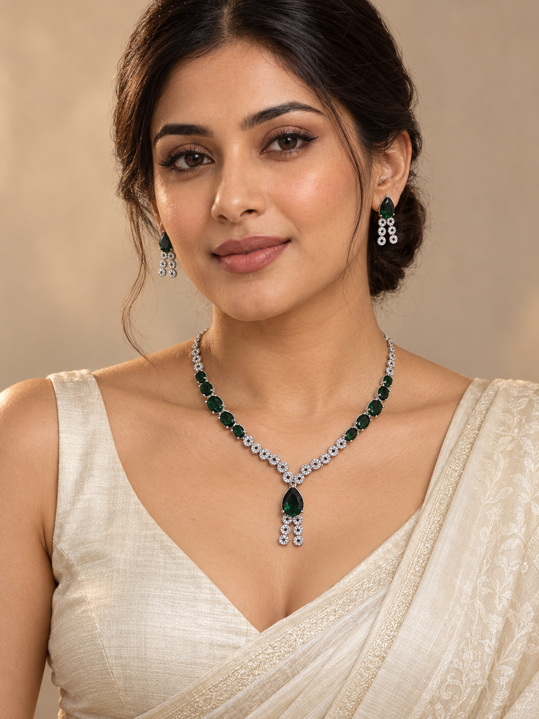 Riddhima dark green American diamond necklace set with green teardrop stones, floral detailing and matching drop earrings