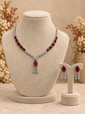 Riddhima purple American diamond necklace set with purple teardrop stones, floral detailing and matching drop earrings