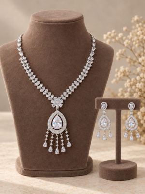 Surbhi white American Diamond necklace set with teardrop pendant and matching earrings