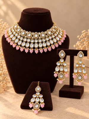 Asmita light pink Kundan choker jewellery set with earrings and maang tikka