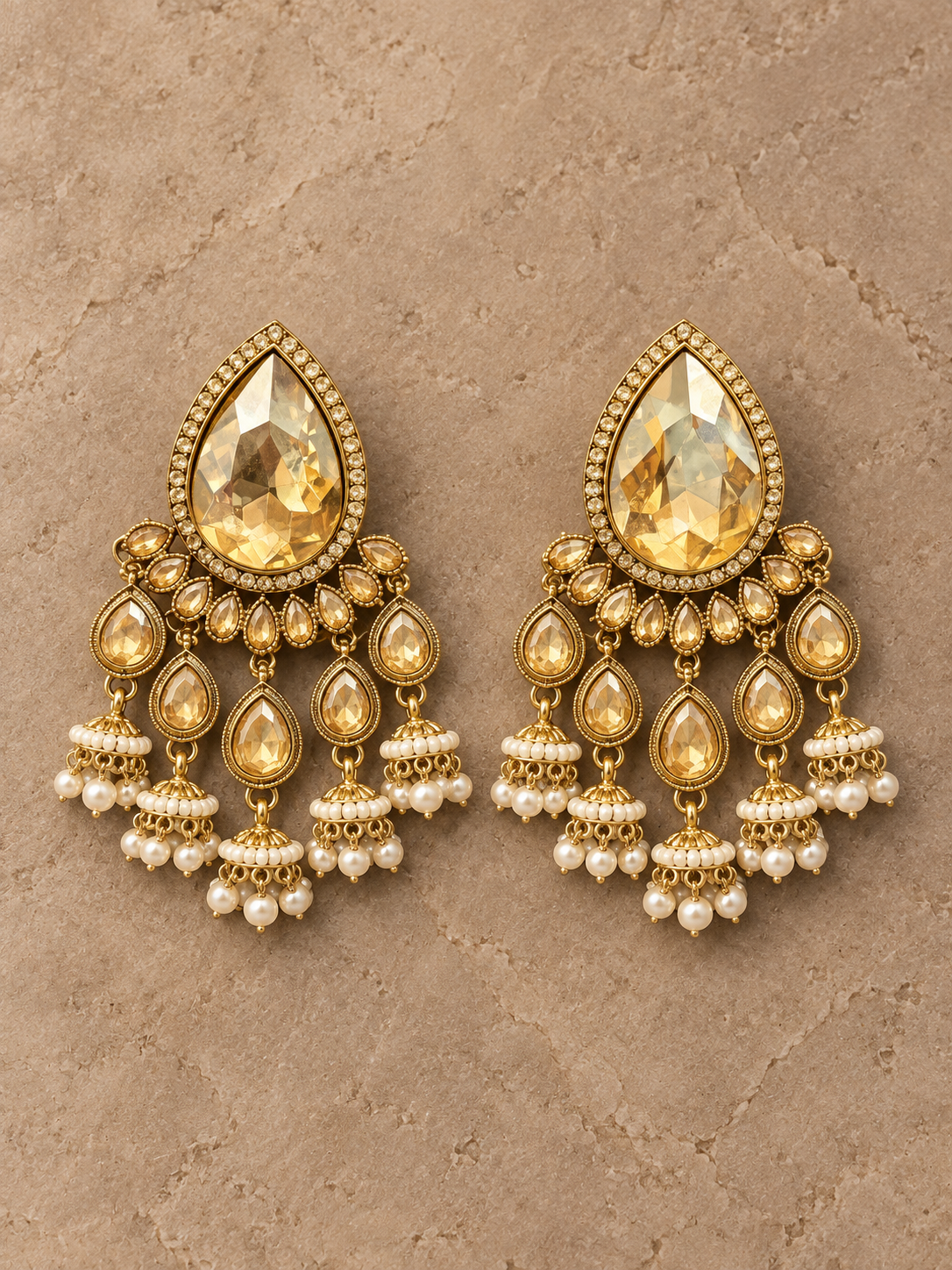 Kamya golden stone jhumka earrings with cascading teardrop drops
