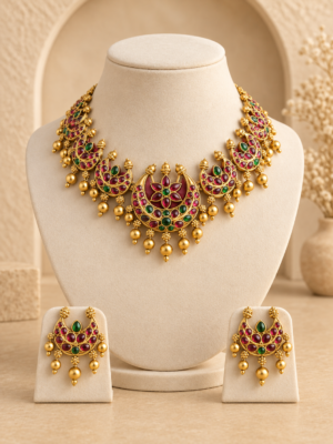 Ruby green temple necklace set with floral detailing and matching earrings