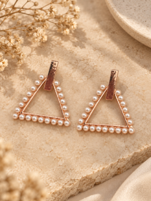 Tara rose gold pearl triangle earrings with a geometric open design