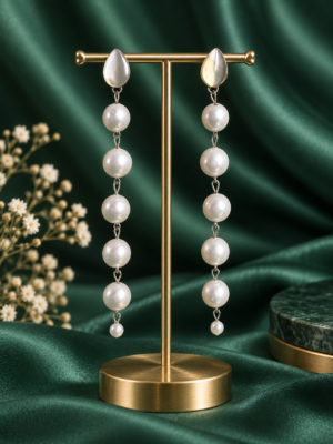 Silver-toned teardrop long white pearl earrings measuring 12 cm