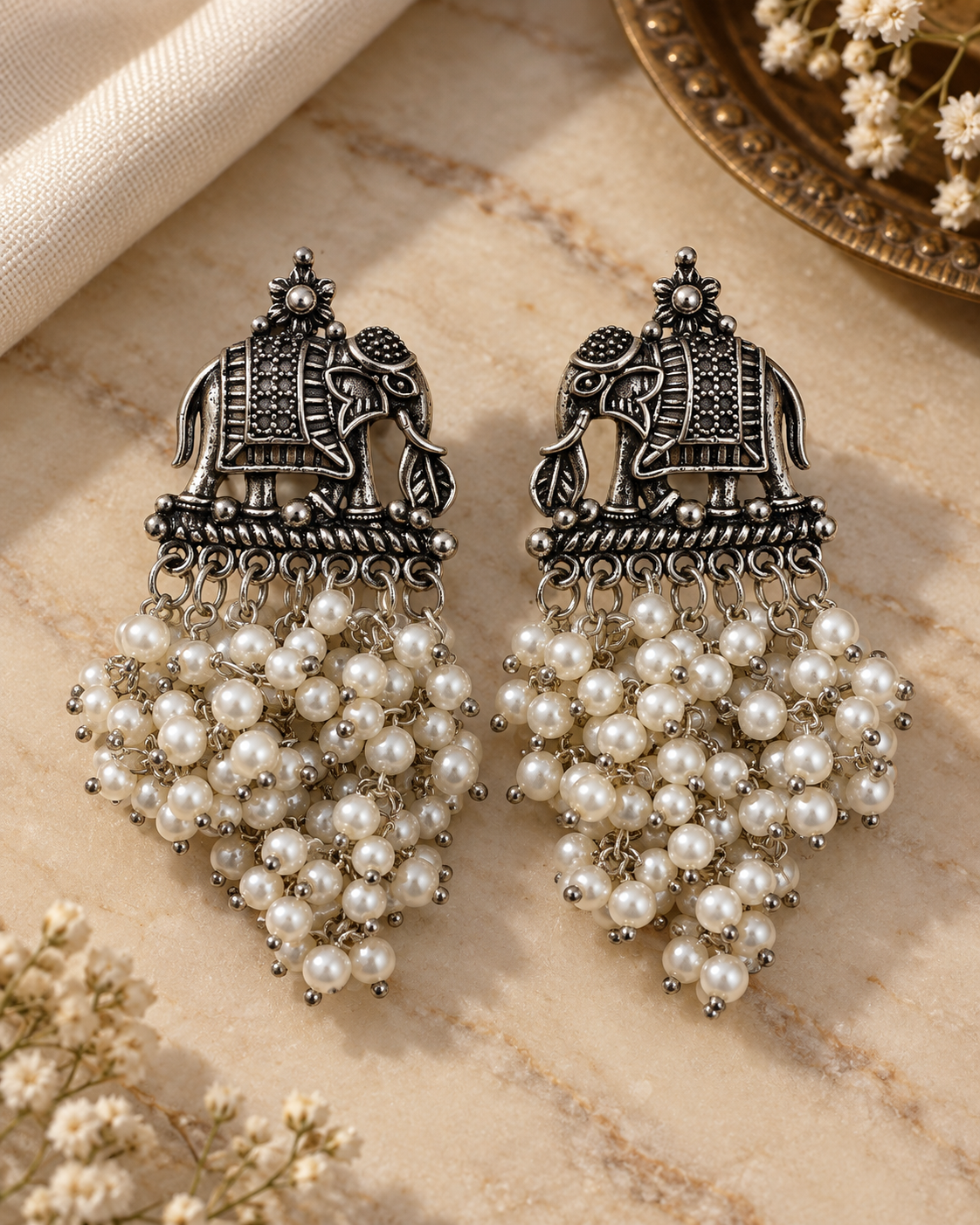 Vanya oxidised elephant pearl earrings with cascading white beads