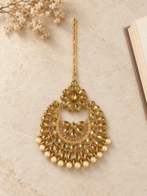 Golden Kundan-style chandbali mangtika with pearl-style drops