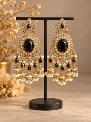 Samyukta black Kundan jhumka earrings with oval stones and miniature jhumka drops
