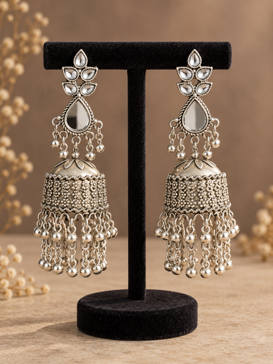 Pair of 11 cm Dhwani oxidised silver-tone jhumka earrings with reflective teardrop details and hanging ghungroo chains
