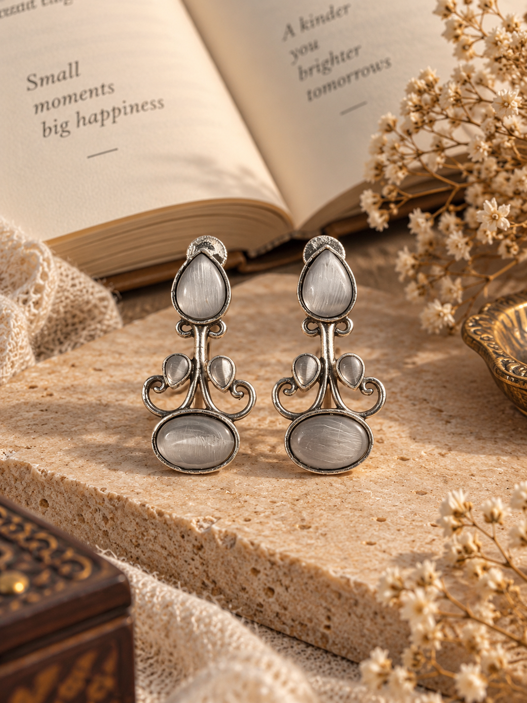 White Stone Brass Earrings with cat-eye stones and silver-toned floral curves