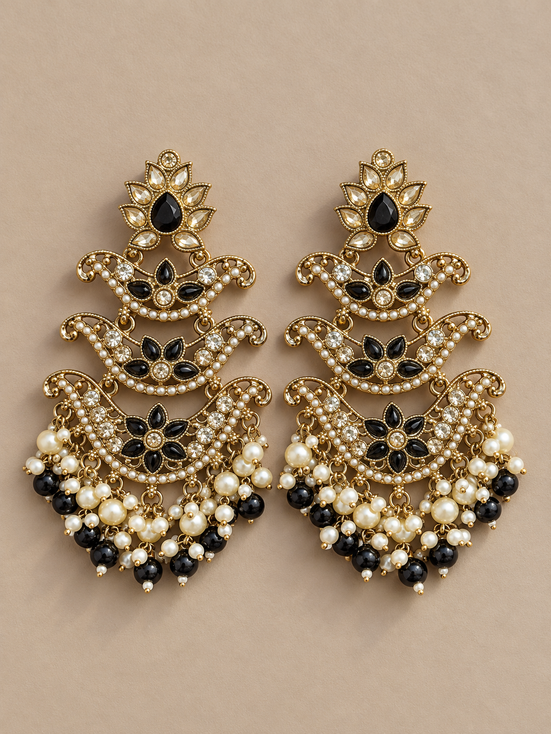 Ragini black Kundan chandelier earrings with tiered crescent motifs, pearl clusters and black bead drops