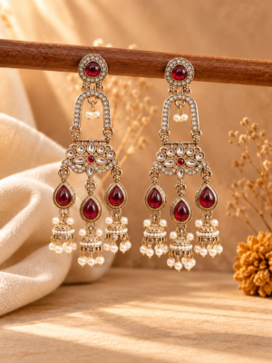 Mrinalika red triple jhumka earrings with open arches, floral stone panels and three miniature jhumka hangings