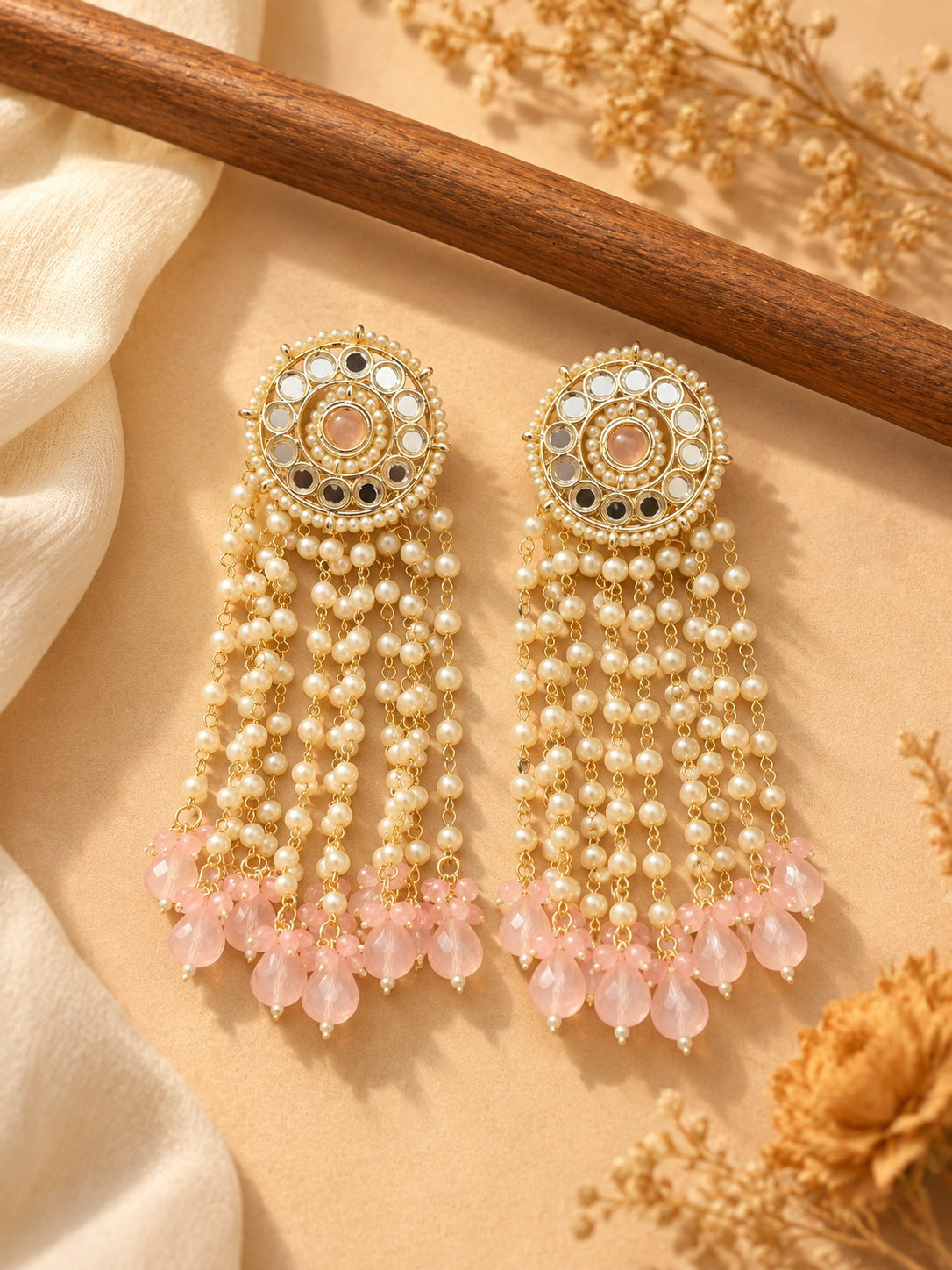 Maheera light pink long Kundan tassel earrings with circular ornamental tops and cascading beaded chains