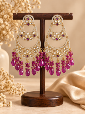 Varnika purple layered Kundan chandbali earrings with floral motifs, clear stone borders and cascading bead drops