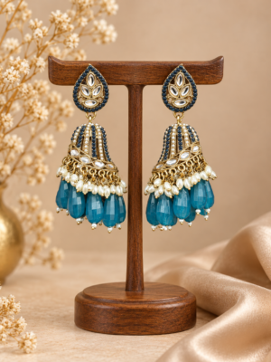 Chitra teal blue jhumka earrings with teardrop tops, gold-tone domes, white bead accents and dangling teal blue drops