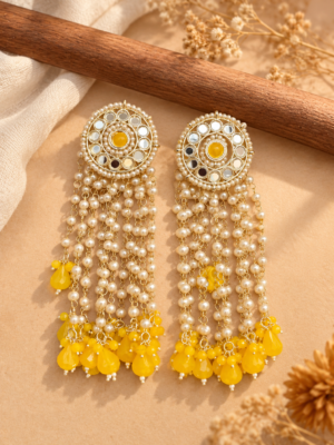 Maheera yellow long Kundan tassel earrings with circular ornamental tops and cascading beaded chains