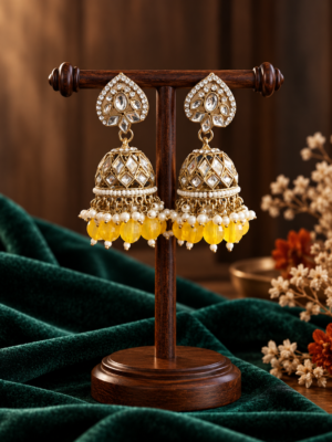 Aadya yellow Kundan jhumka earrings with ornamental tops, stone-set domes and hanging bead accents