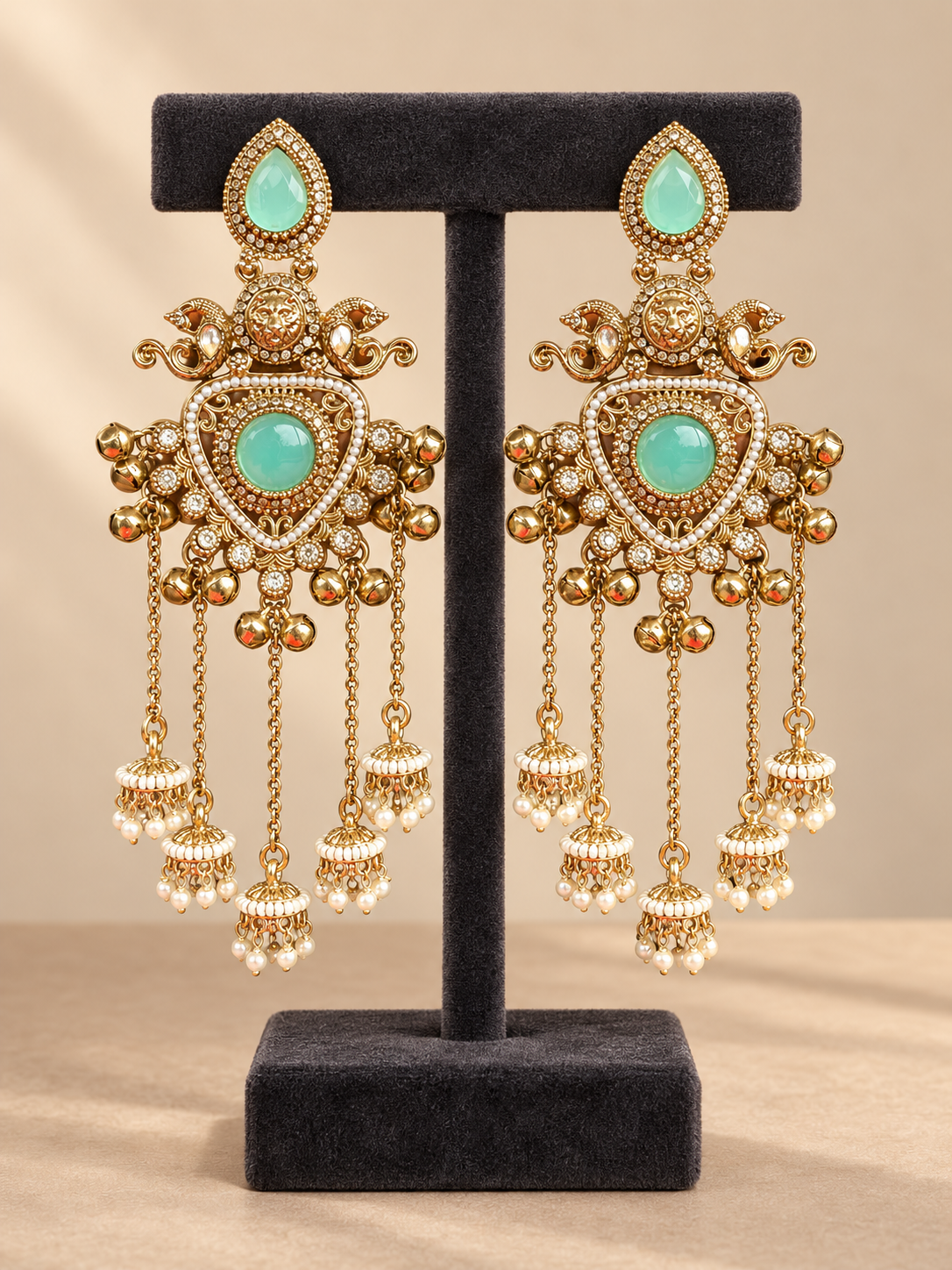 Namita mint green Kashmiri peacock jhumka earrings with ghungroo accents and cascading miniature jhumka drops