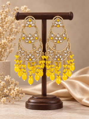 Varnika yellow layered Kundan chandbali earrings with floral motifs, clear stone borders and cascading bead drops