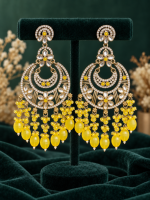 Yashika yellow Kundan chandbali earrings with layered crescents, floral motifs and cascading bead drops